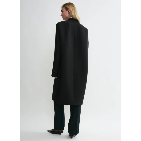 Totême Deep pleat coat in Black - Coats - Scandinavian Minimalist Luxury at Coveti
