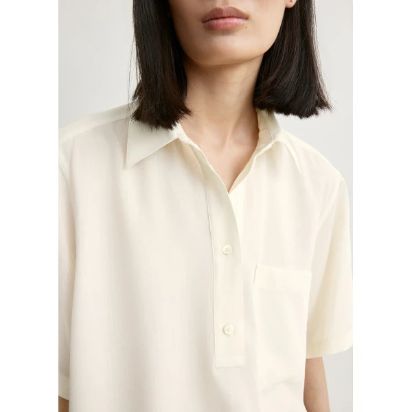 Totême Fluid polo shirt in Ecru - Tops - Scandinavian Minimalist Luxury at Coveti