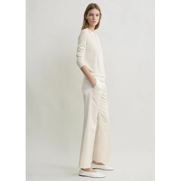 Totême Kick flare raw-edge trousers in Stone - Pants - Scandinavian Minimalist Luxury at Coveti