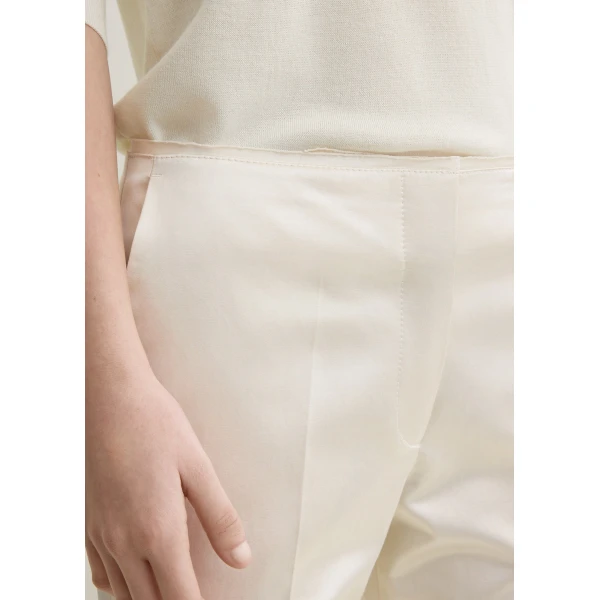 Totême Kick flare raw-edge trousers in Stone - Pants - Scandinavian Minimalist Luxury at Coveti