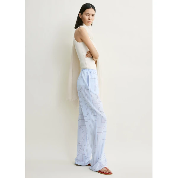 Totême Monogram cotton-blend pj bottoms in Sky - Pants - Scandinavian Minimalist Luxury at Coveti