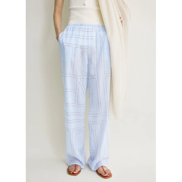 Totême Monogram cotton-blend pj bottoms in Sky - Pants - Scandinavian Minimalist Luxury at Coveti