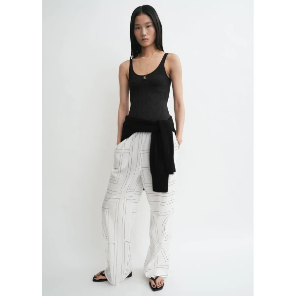 Totême Monogram cotton-blend pj bottoms in White / Black - Pants - Scandinavian Minimalist Luxury at Coveti