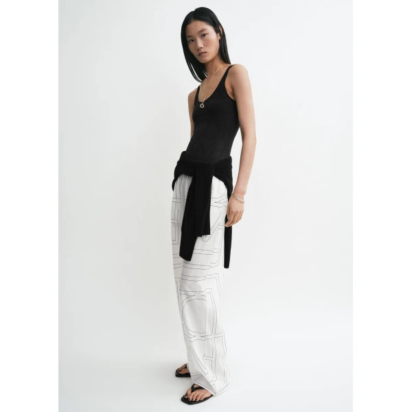 Totême Monogram cotton-blend pj bottoms in White / Black - Pants - Scandinavian Minimalist Luxury at Coveti