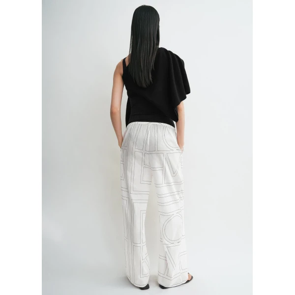 Totême Monogram cotton-blend pj bottoms in White / Black - Pants - Scandinavian Minimalist Luxury at Coveti