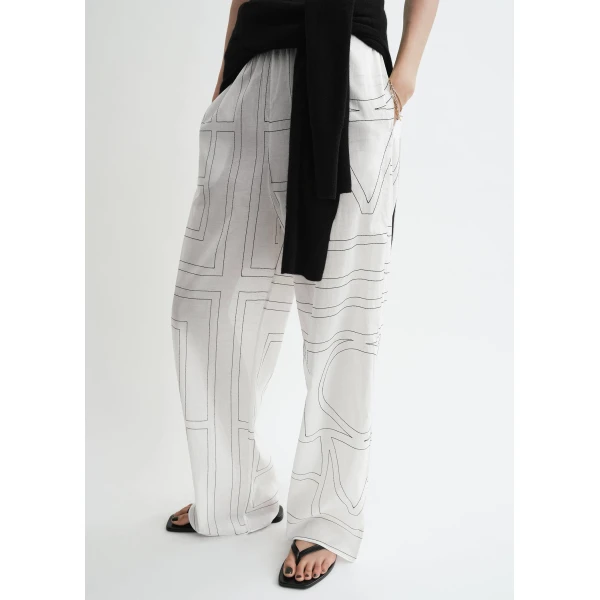 Totême Monogram cotton-blend pj bottoms in White / Black - Pants - Scandinavian Minimalist Luxury at Coveti