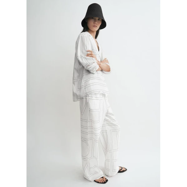 Totême Monogram cotton-blend pj top in White / Black - Tops - Scandinavian Minimalist Luxury at Coveti