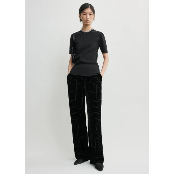 Totême Monogram devoré pj bottoms in Black - Pants - Scandinavian Minimalist Luxury at Coveti
