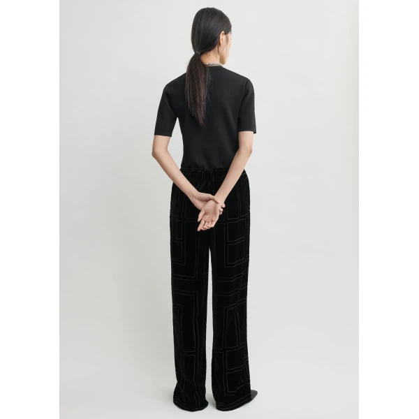 Totême Monogram devoré pj bottoms in Black - Pants - Scandinavian Minimalist Luxury at Coveti