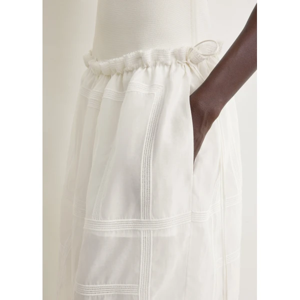 Totême Monogram mini skirt in White - Skirts - Scandinavian Minimalist Luxury at Coveti