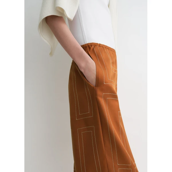 Totême Monogram silk pj bottoms in Terracotta - Pants - Scandinavian Minimalist Luxury at Coveti