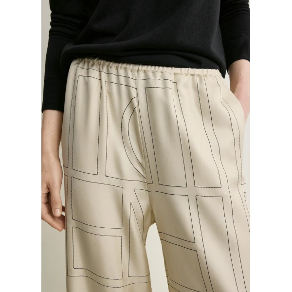 Totême Monogram silk pj bottoms ivory in Ivory monogram - Pants - Scandinavian Minimalist Luxury at Coveti