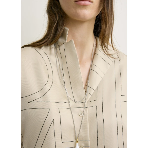 Totême Monogram silk pj top in Ivory - Tops - Scandinavian Minimalist Luxury at Coveti