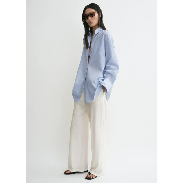 Totême Oversized summer shirt in Sky - Tops - Scandinavian Minimalist Luxury at Coveti