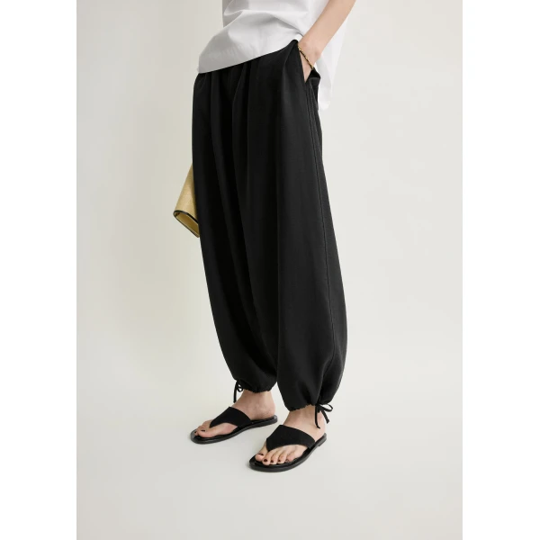Totême Parachute trousers in Black - Pants - Scandinavian Minimalist Luxury at Coveti