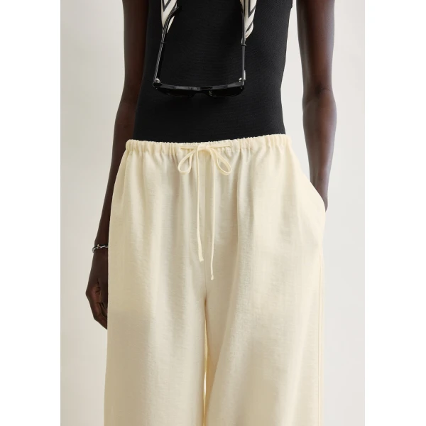 Totême Parachute trousers in Off-white - Pants - Scandinavian Minimalist Luxury at Coveti