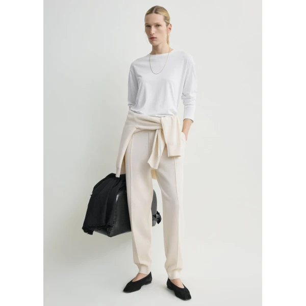 Totême Pintucked sweatpants in Ecru - Pants - Scandinavian Minimalist Luxury at Coveti