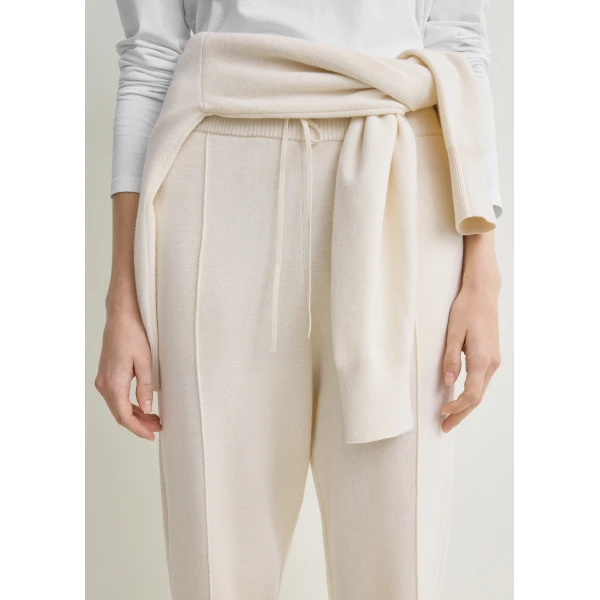 Totême Pintucked sweatpants in Ecru - Pants - Scandinavian Minimalist Luxury at Coveti