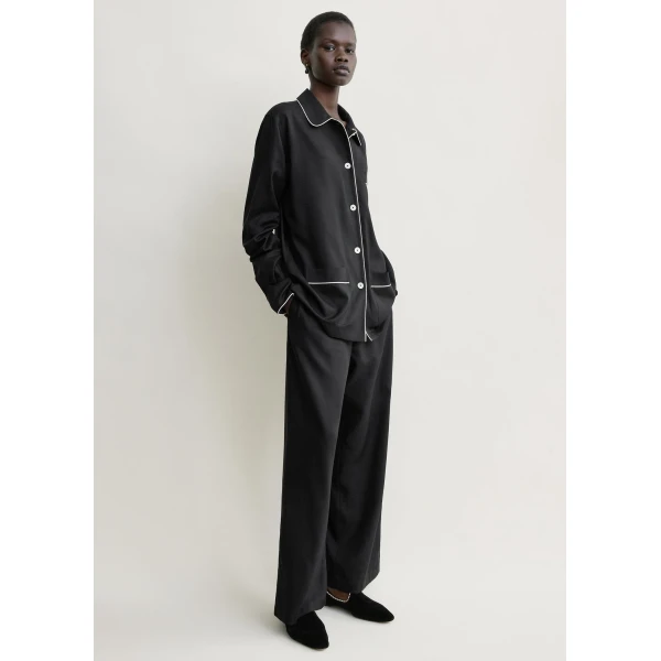 Totême Piped pj top in Black - Tops - Scandinavian Minimalist Luxury at Coveti