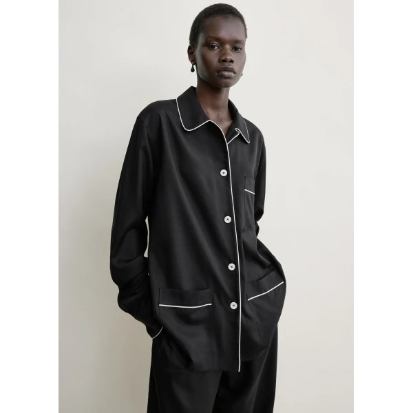 Totême Piped pj top in Black - Tops - Scandinavian Minimalist Luxury at Coveti