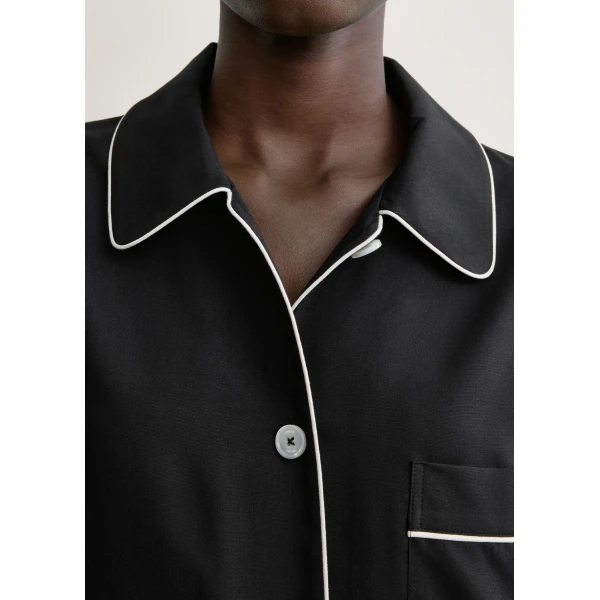 Totême Piped pj top in Black - Tops - Scandinavian Minimalist Luxury at Coveti