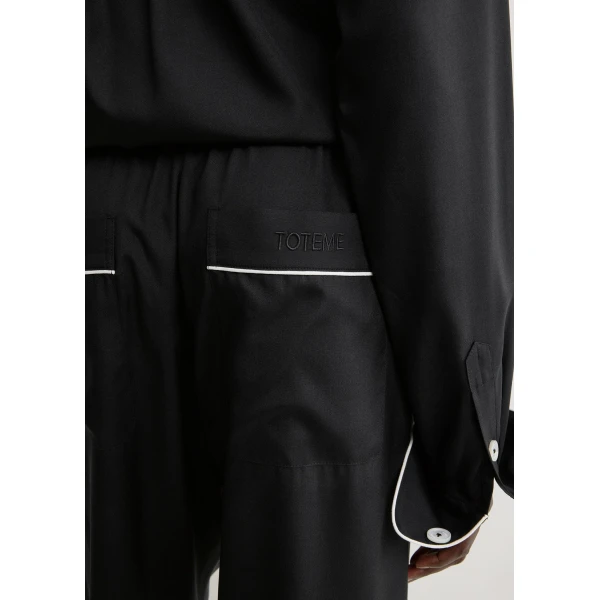 Totême Piped silk trousers in Black - Pants - Scandinavian Minimalist Luxury at Coveti