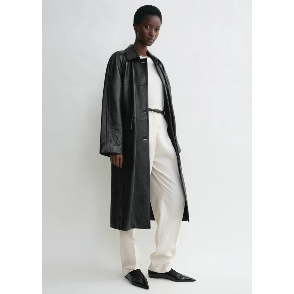 Totême Raglan-sleeve leather coat in Black - Coats - Scandinavian Minimalist Luxury at Coveti