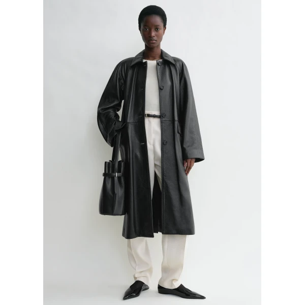 Totême Raglan-sleeve leather coat in Black - Coats - Scandinavian Minimalist Luxury at Coveti