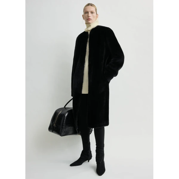 Totême Shearling midi coat in Black - Coats - Scandinavian Minimalist Luxury at Coveti