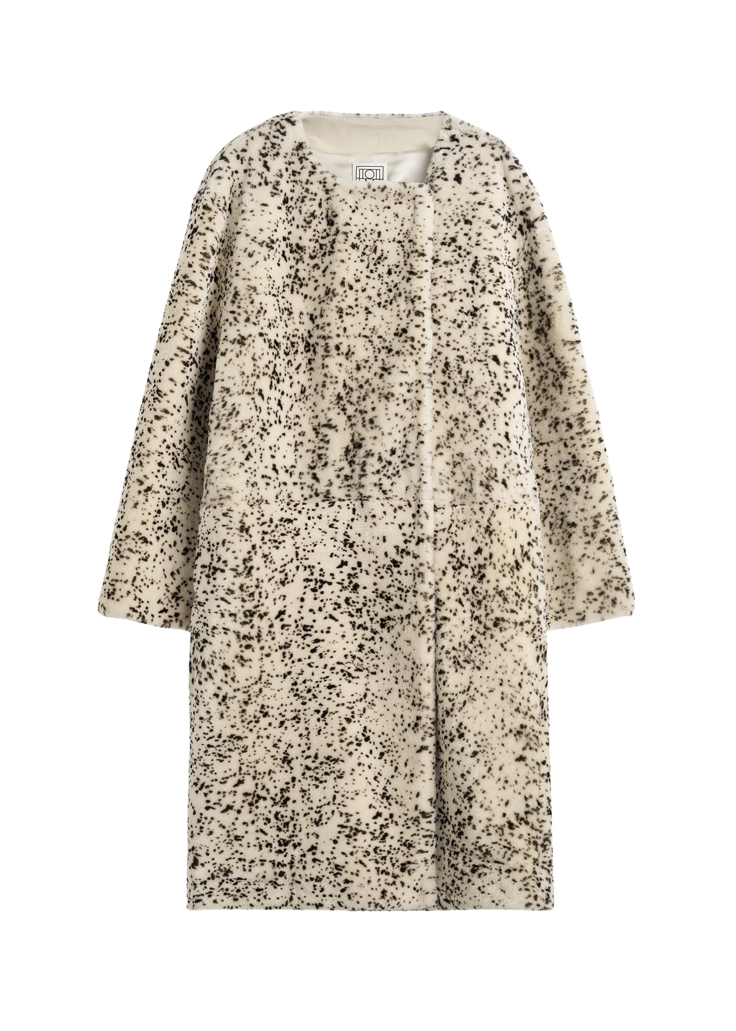 Totême Stracciatella shearling coat black/white in Black-white - Coats - Scandinavian Minimalist Luxury at Coveti