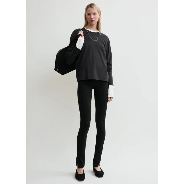 Totême Zip leggings in Black - Pants - Scandinavian Minimalist Luxury at Coveti