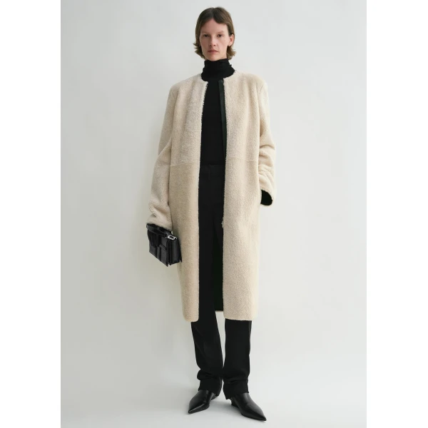 Totême Zipped teddy shearling coat in Cream - Coats - Scandinavian Minimalist Luxury at Coveti