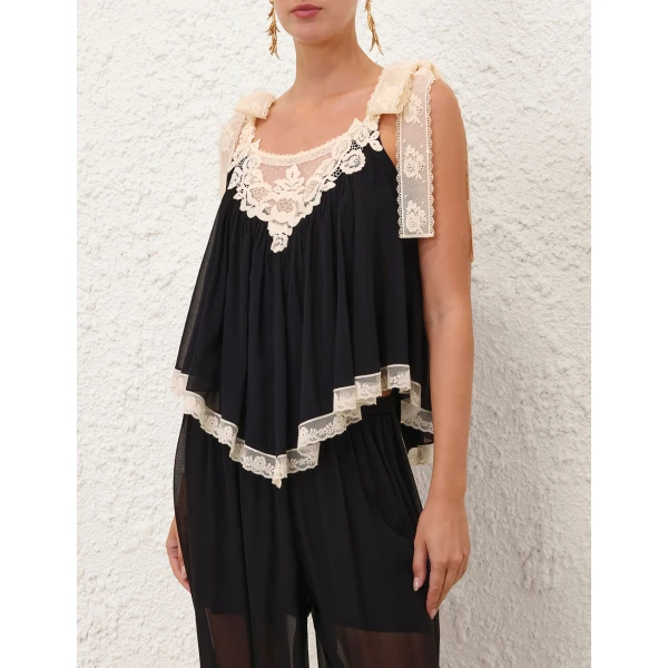 Elevate your elegance in this Zimmermann Tops available now at Coveti