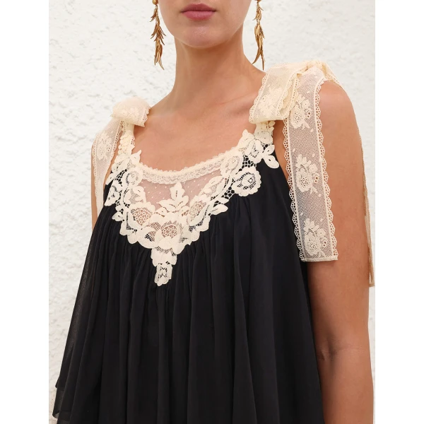 Elevate your elegance in this Zimmermann Tops available now at Coveti
