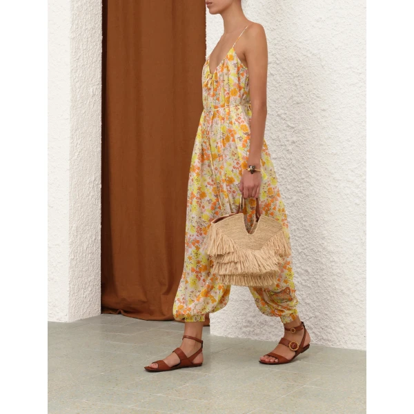 Elevate your elegance in this Zimmermann Jumpsuit available now at Coveti