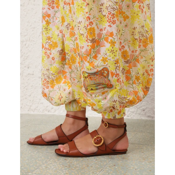 Elevate your elegance in this Zimmermann Jumpsuit available now at Coveti