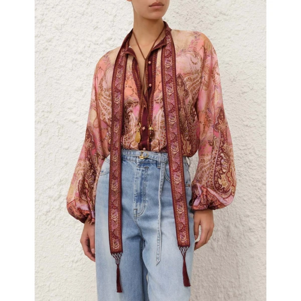 Elevate your elegance in this Zimmermann Tops available now at Coveti