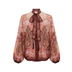 Elevate your elegance in this Zimmermann Tops available now at Coveti