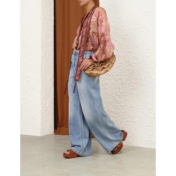 Elevate your elegance in this Zimmermann Tops available now at Coveti