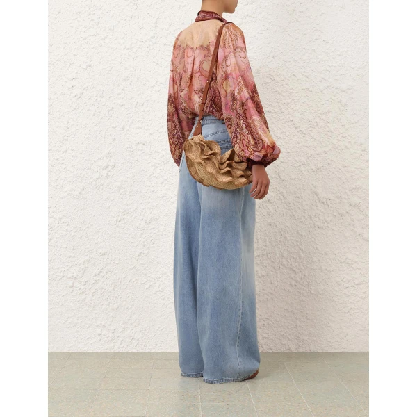 Elevate your elegance in this Zimmermann Tops available now at Coveti