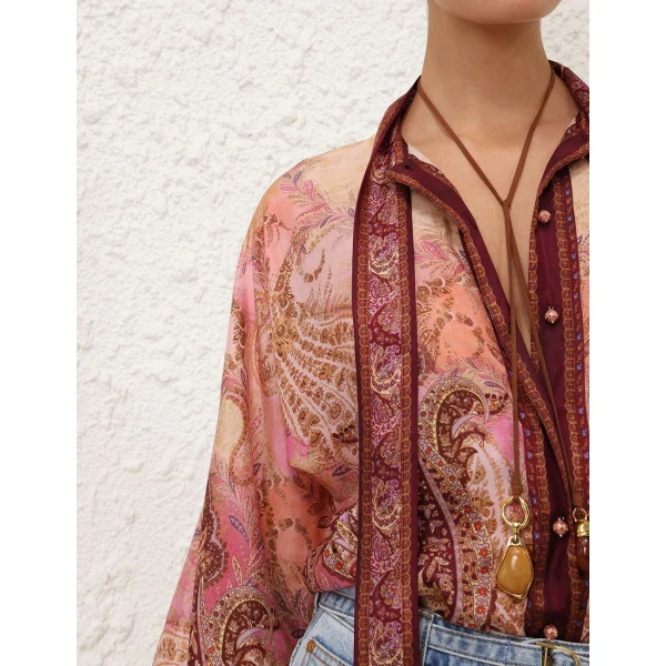 Elevate your elegance in this Zimmermann Tops available now at Coveti
