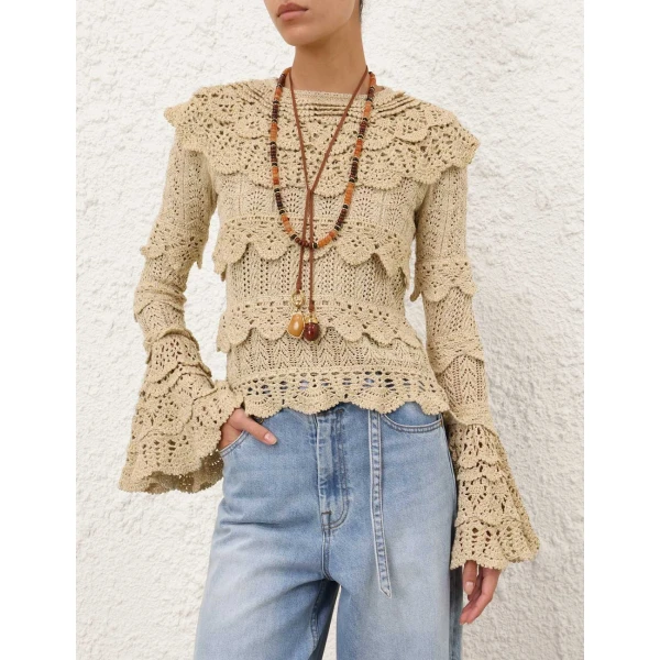 Elevate your elegance in this Zimmermann Tops available now at Coveti