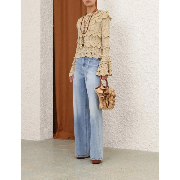 Elevate your elegance in this Zimmermann Tops available now at Coveti