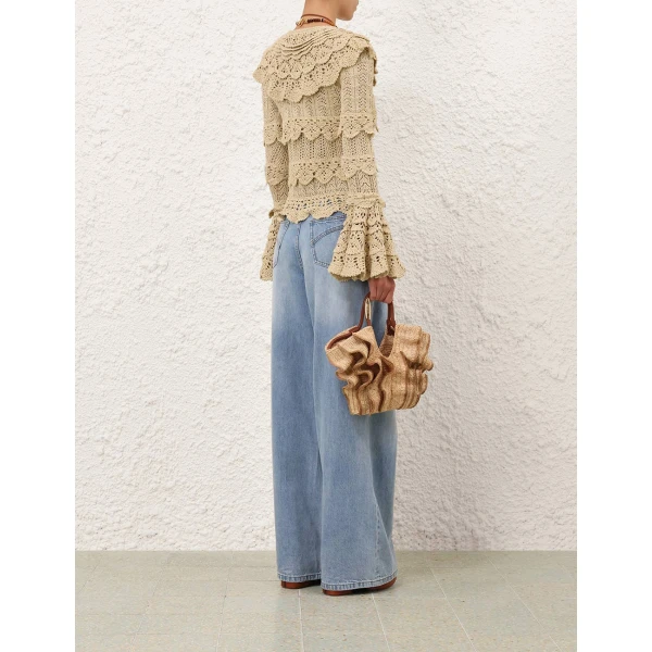 Elevate your elegance in this Zimmermann Tops available now at Coveti