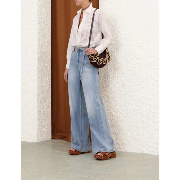 Elevate your elegance in this Zimmermann Tops available now at Coveti
