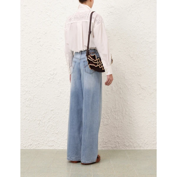 Elevate your elegance in this Zimmermann Tops available now at Coveti