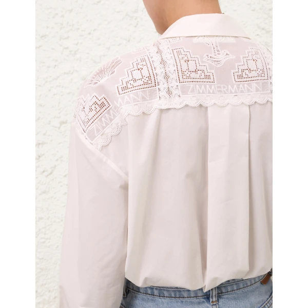 Elevate your elegance in this Zimmermann Tops available now at Coveti