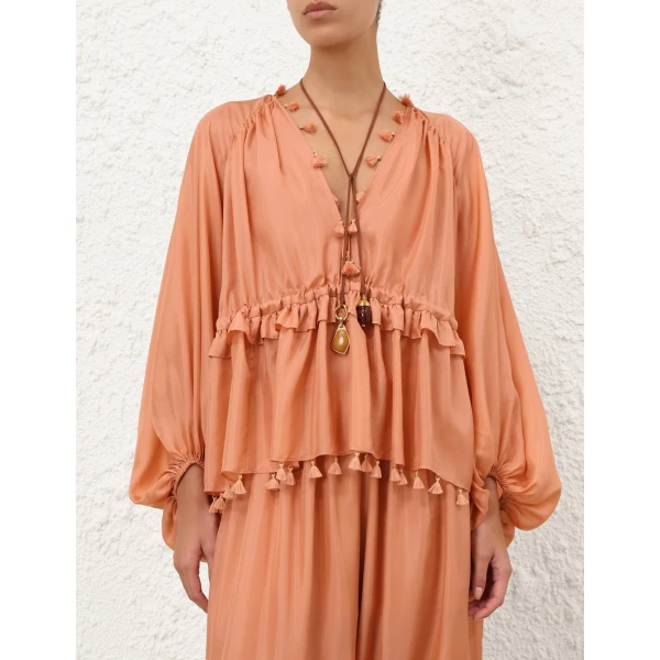 Elevate your elegance in this Zimmermann Tops available now at Coveti