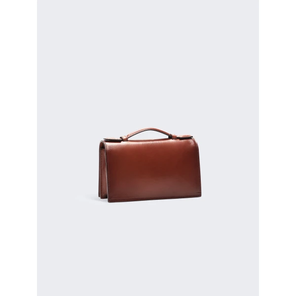 schiaparelli molded mouth chain clutch price