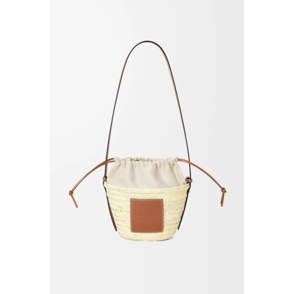 Loewe Drawstring bucket in palm leaf and calfskin, Natural/Tan | Totes & Top-Handle Bags | Coveti